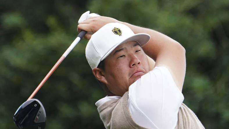 Sep 24, 2022; Charlotte, North Carolina, USA; International Team golfer Sungjae Im hits his tee shot on the 10th hole during the foursomes match play of the Presidents Cup golf tournament at Quail Hollow Club. Mandatory Credit: Peter Casey-USA TODAY Sports