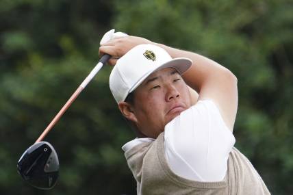 Sep 24, 2022; Charlotte, North Carolina, USA; International Team golfer Sungjae Im hits his tee shot on the 10th hole during the foursomes match play of the Presidents Cup golf tournament at Quail Hollow Club. Mandatory Credit: Peter Casey-USA TODAY Sports
