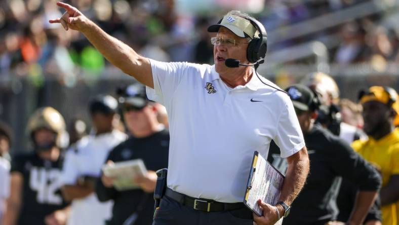 Sep 24, 2022; Orlando, Florida, USA; UCF Knights head coach Gus Malzahn calls a play during the second quarter against the Georgia Tech Yellow Jackets at FBC Mortgage Stadium. Mandatory Credit: Mike Watters-USA TODAY Sports