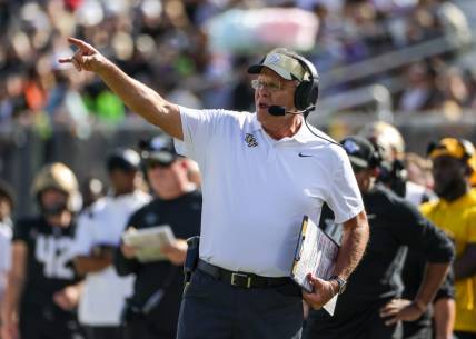 Sep 24, 2022; Orlando, Florida, USA; UCF Knights head coach Gus Malzahn calls a play during the second quarter against the Georgia Tech Yellow Jackets at FBC Mortgage Stadium. Mandatory Credit: Mike Watters-USA TODAY Sports