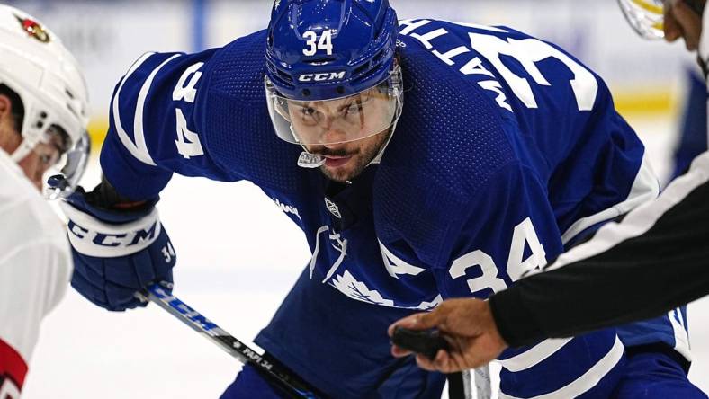 Sep 24, 2022; Toronto, Ontario, CAN; Toronto Maple Leafs forward Auston Matthews (34) keeps his eye on the puck before a face off against the Ottawa Senators during the second period at Scotiabank Arena. Mandatory Credit: John E. Sokolowski-USA TODAY Sports