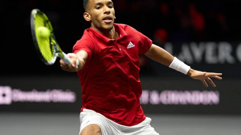 Sep 25, 2022; London, United Kingdom; Felix Auger-Aliassime (CAN) plays a shot against Novak Djokovic (SRB) in Lavers Cup singles. Mandatory Credit: Peter van den Berg-USA TODAY Sports