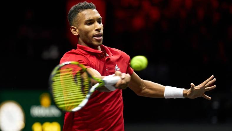 Sep 25, 2022; London, United Kingdom; Felix Auger-Aliassime (CAN) plays a shot against Novak Djokovic (SRB) in Lavers Cup singles. Mandatory Credit: Peter van den Berg-USA TODAY Sports