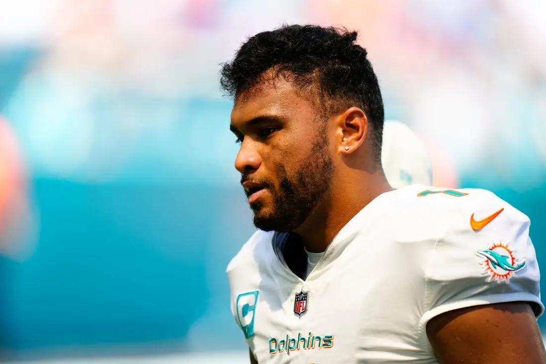 Sep 25, 2022; Miami Gardens, Florida, USA; Miami Dolphins quarterback Tua Tagovailoa (1) is helped off the field by staff after a apparent injury against the Buffalo Bills during the second quarter at Hard Rock Stadium. Mandatory Credit: Rich Storry-USA TODAY Sports