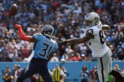 Sep 25, 2022; Nashville, Tennessee, USA; Tennessee Titans safety Kevin Byard (31) knocks away the game-tying two-point attempt intended for Las Vegas Raiders tight end Darren Waller (83) during the second half at Nissan Stadium. Mandatory Credit: Christopher Hanewinckel-USA TODAY Sports
