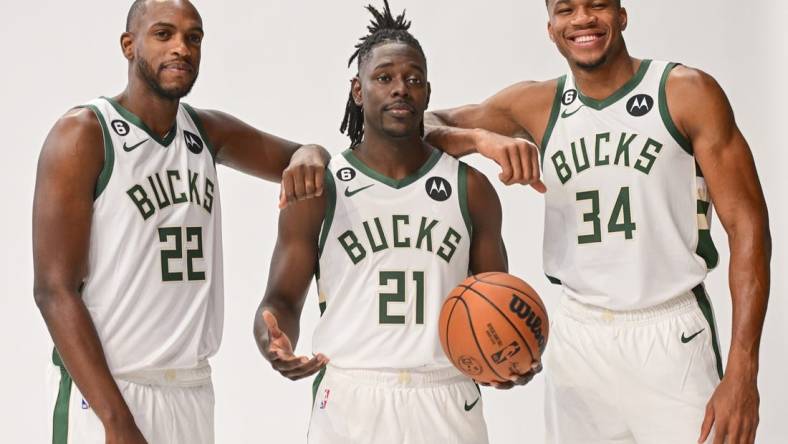 Sep 25, 2022; Milwaukee, WI, USA;  Milwaukee Bucks forward Khris Middleton (22), guard Jrue Holiday (21) and forward Giannis Antetokounmpo (34) pose for a picture during media day at the Fiserv Forum.Mandatory Credit: Benny Sieu-USA TODAY Sports