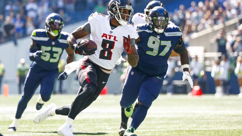 Sep 25, 2022; Seattle, Washington, USA; Atlanta Falcons tight end Kyle Pitts (8) runs for yards after the catch against the Seattle Seahawks during the first quarter at Lumen Field. Mandatory Credit: Joe Nicholson-USA TODAY Sports
