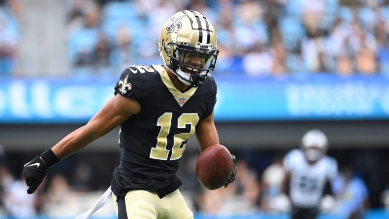 Sep 25, 2022; Charlotte, North Carolina, USA; New Orleans Saints wide receiver Chris Olave (12) reacts after catching the ball in the second quarter at Bank of America Stadium. Mandatory Credit: Bob Donnan-USA TODAY Sports