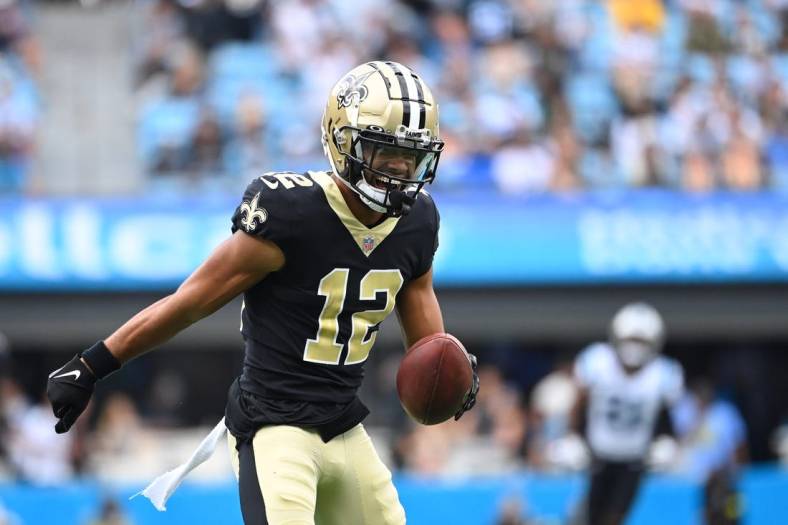 Sep 25, 2022; Charlotte, North Carolina, USA; New Orleans Saints wide receiver Chris Olave (12) reacts after catching the ball in the second quarter at Bank of America Stadium. Mandatory Credit: Bob Donnan-USA TODAY Sports