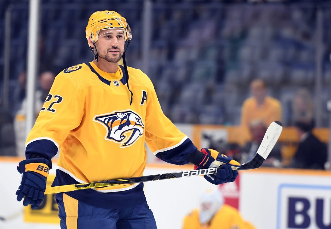 Sep 26, 2022; Nashville, Tennessee, USA; Nashville Predators right wing Nino Niederreiter (22) waits for the puck during warmups before the game against the Florida Panthers at Bridgestone Arena. Mandatory Credit: Christopher Hanewinckel-USA TODAY Sports