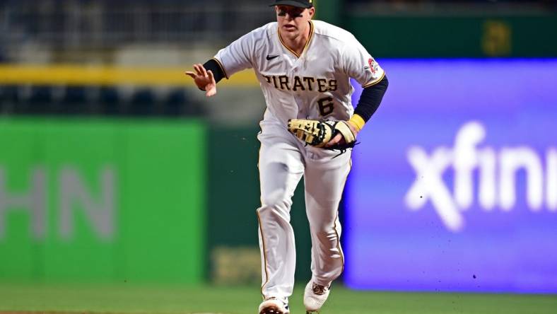 Sep 27, 2022; Pittsburgh, Pennsylvania, USA; Pittsburgh Pirates catcher Zack Collins (6) runs to first base for the force out during the third inning against the Cincinnati Reds at PNC Park. Mandatory Credit: David Dermer-USA TODAY Sports