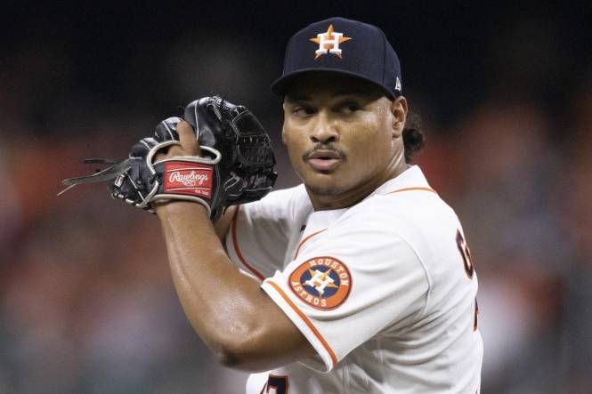 Houston Astros starting pitcher Luis Garcia (77) pitches during