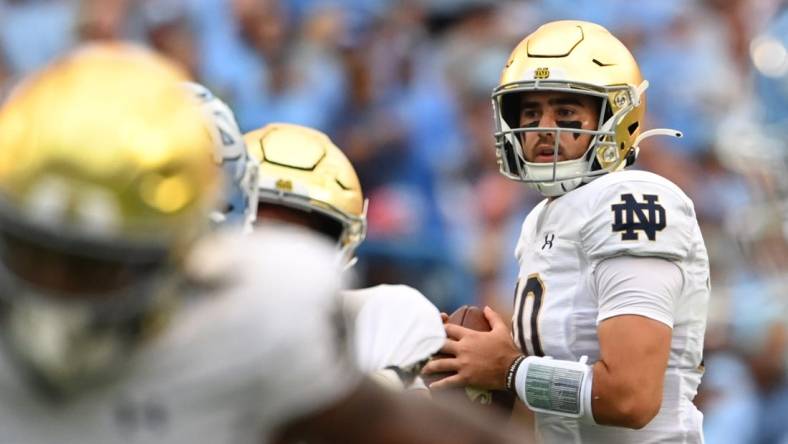 Sep 24, 2022; Chapel Hill, North Carolina, USA; Notre Dame Fighting Irish quarterback Drew Pyne (10) looks to pass in the second quarter at Kenan Memorial Stadium. Mandatory Credit: Bob Donnan-USA TODAY Sports