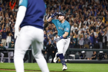 Sep 30, 2022; Seattle, Washington, USA; Seattle Mariners catcher Cal Raleigh (29) reacts after hitting a walk-off solo-home run against the Oakland Athletics during the ninth inning at T-Mobile Park. Seattle defeated Oakland 2-1, clinching a wild card and ending a 21-year playoff drought. Mandatory Credit: Joe Nicholson-USA TODAY Sports