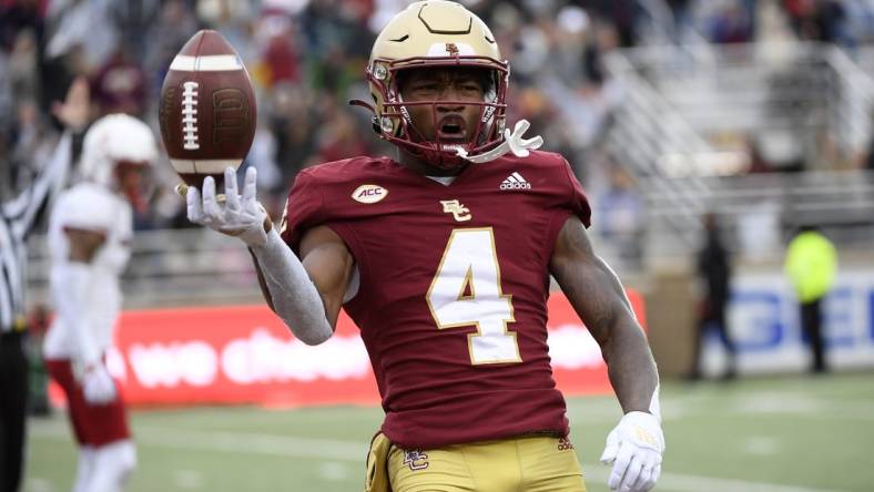 Oct 1, 2022; Chestnut Hill, Massachusetts, USA;  Boston College Eagles wide receiver Zay Flowers (4) reacts after scoring a touchdown during the first half against the Louisville Cardinals at Alumni Stadium. Mandatory Credit: Bob DeChiara-USA TODAY Sports