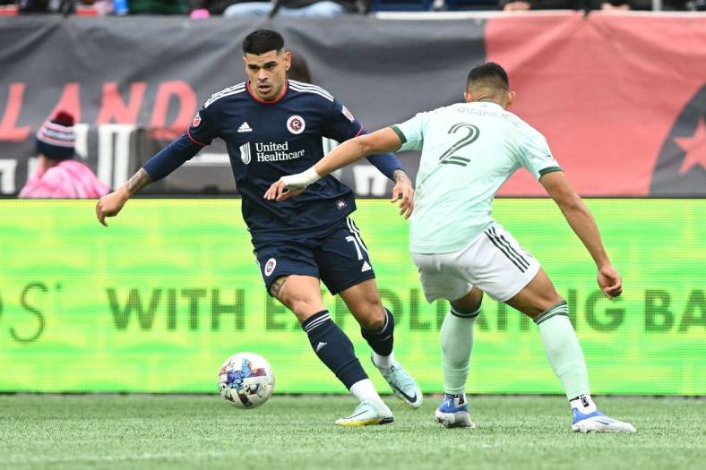 Oct 1, 2022; Foxborough, Massachusetts, USA; New England Revolution forward Gustavo Bou (7) controls the ball in front of Atlanta United defender Ronald Hernandez (2) during the first half at Gillette Stadium. Mandatory Credit: Brian Fluharty-USA TODAY Sports