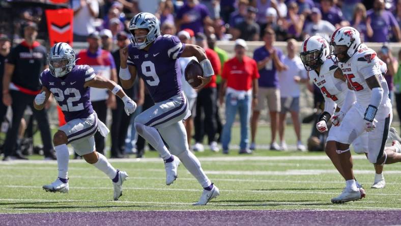 Oct 1, 2022; Manhattan, Kansas, USA; Kansas State Wildcats quarterback Adrian Martinez (9) breaks away from several Texas Tech Red Raiders defenders on his way to a touchdown in the fourth quarter at Bill Snyder Family Football Stadium. Mandatory Credit: Scott Sewell-USA TODAY Sports