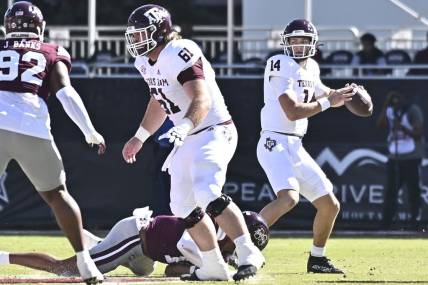 Oct 1, 2022; Starkville, Mississippi, USA; Texas A&M Aggies quarterback Max Johnson (14) looks to pass against the Mississippi State Bulldogs during the first quarter at Davis Wade Stadium at Scott Field. Mandatory Credit: Matt Bush-USA TODAY Sports
