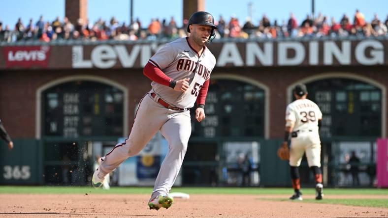 Oct 1, 2022; San Francisco, California, USA; Arizona Diamondbacks first baseman Christian Walker (53) runs to third base on a single hit by second baseman Josh Rojas (10) (not pictured) against the San Francisco Giants during the seventh inning at Oracle Park. Mandatory Credit: Robert Edwards-USA TODAY Sports