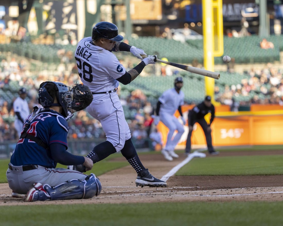 Oct 1, 2022; Detroit, Michigan, USA; Detroit Tigers shortstop Javier Baez (28) hits an RBI single in the first inning against the Minnesota Twins at Comerica Park. Mandatory Credit: David Reginek-USA TODAY Sports