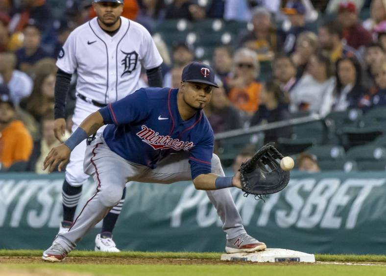 Oct 1, 2022; Detroit, Michigan, USA; Minnesota Twins first baseman Luis Arraez (2) catches the ball for an out in the fifth inning against the Detroit Tigers at Comerica Park. Mandatory Credit: David Reginek-USA TODAY Sports