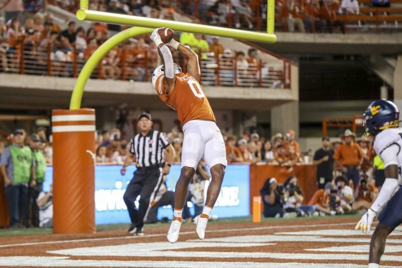 Oct 1, 2022; Austin, Texas, USA; Texas Longhorns tight end Ja'Tavion Sanders (0) catches a pass for a touchdown against the West Virginia Mountaineers during the second quarter at Darrell K Royal-Texas Memorial Stadium. Mandatory Credit: Ben Queen-USA TODAY Sports