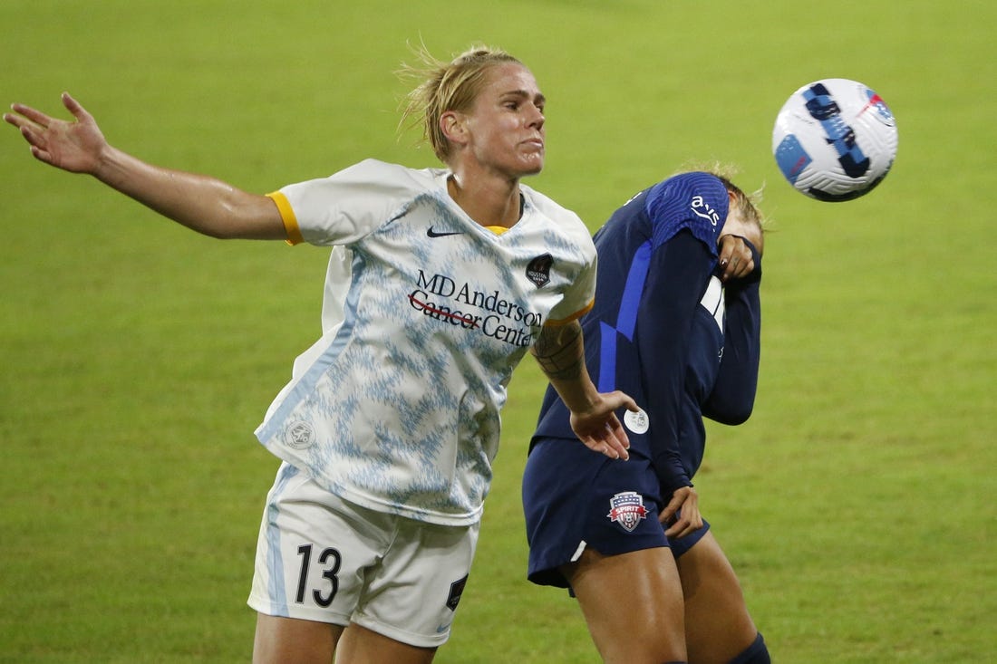 Oct 1, 2022; Washington, District of Columbia, USA; Houston Dash Sophie Schmidt (13) and Washington Spirit forward Trinity Rodman (2) battle for the ball in the second half at Audi Field. Mandatory Credit: Amber Searls-USA TODAY Sports