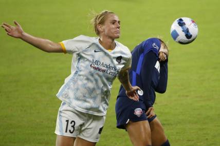 Oct 1, 2022; Washington, District of Columbia, USA; Houston Dash Sophie Schmidt (13) and Washington Spirit forward Trinity Rodman (2) battle for the ball in the second half at Audi Field. Mandatory Credit: Amber Searls-USA TODAY Sports
