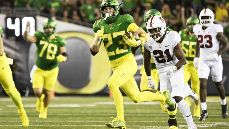 Oct 1, 2022; Eugene, Oregon, USA; Oregon Ducks wide receiver Chase Cota (23) catches a pass for a touchdown during the first half against the Stanford Cardinal at Autzen Stadium. Mandatory Credit: Troy Wayrynen-USA TODAY Sports