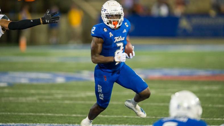 Oct 1, 2022; Tulsa, Oklahoma, USA; Tulsa Golden Hurricane wide receiver Keylon Stokes (2) runs after a catch during the first quarter against the Cincinnati Bearcats at Skelly Field at H.A. Chapman Stadium. Cincinnati won 31-21. Mandatory Credit: Brett Rojo-USA TODAY Sports