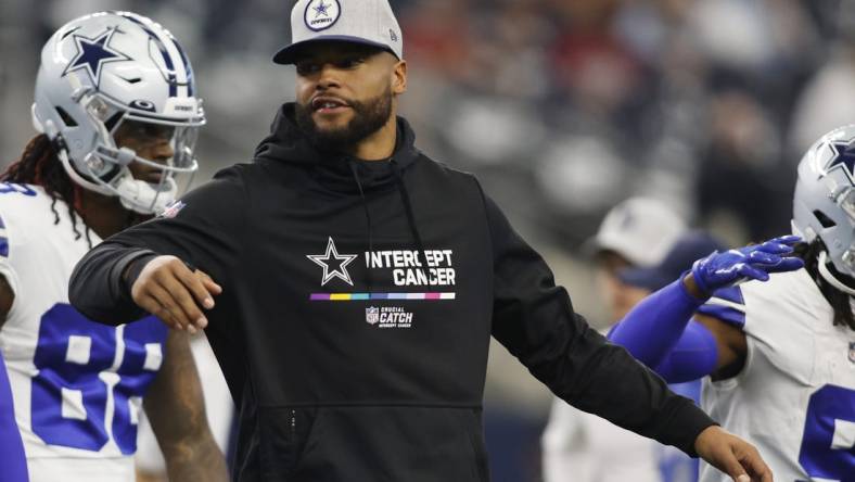 Oct 2, 2022; Arlington, Texas, USA; Dallas Cowboys quarterback Dak Prescott (4) on the field before the game against the Washington Commanders at AT&T Stadium. Mandatory Credit: Tim Heitman-USA TODAY Sports