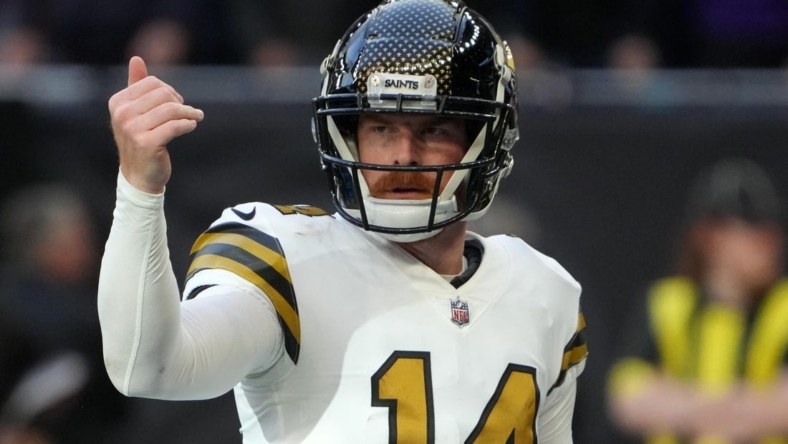 Oct 2, 2022; London, United Kingdom; New Orleans Saints quarterback Andy Dalton (14) gestures in the second half against the Minnesota Vikings during an NFL International Series game at Tottenham Hotspur Stadium. The Vikings defeated the Saints 28-25. Mandatory Credit: Kirby Lee-USA TODAY Sports