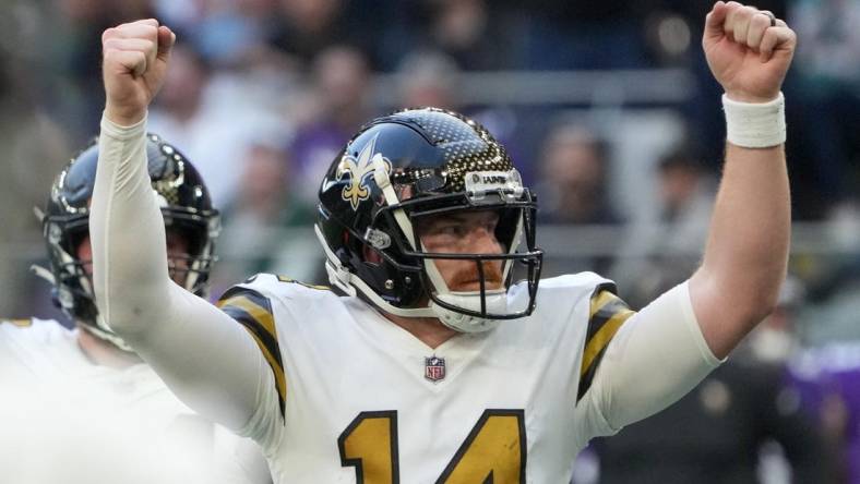 Oct 2, 2022; London, United Kingdom; New Orleans Saints quarterback Andy Dalton (14) celebrates in the fourth quarter against the Minnesota Vikings during an NFL International Series game at Tottenham Hotspur Stadium. The Vikings defeated the Saints 28-25. Mandatory Credit: Kirby Lee-USA TODAY Sports