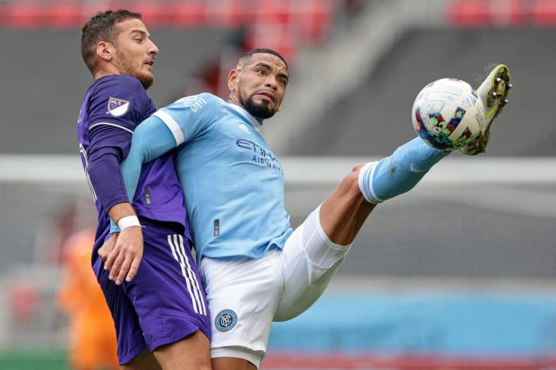 Oct 2, 2022; Harrison, New Jersey, USA; New York City FC defender Alexander Callens (6) battles for the ball against Orlando City SC forward Ercan Kara (9) during the first half at Red Bull Arena. Mandatory Credit: Vincent Carchietta-USA TODAY Sports