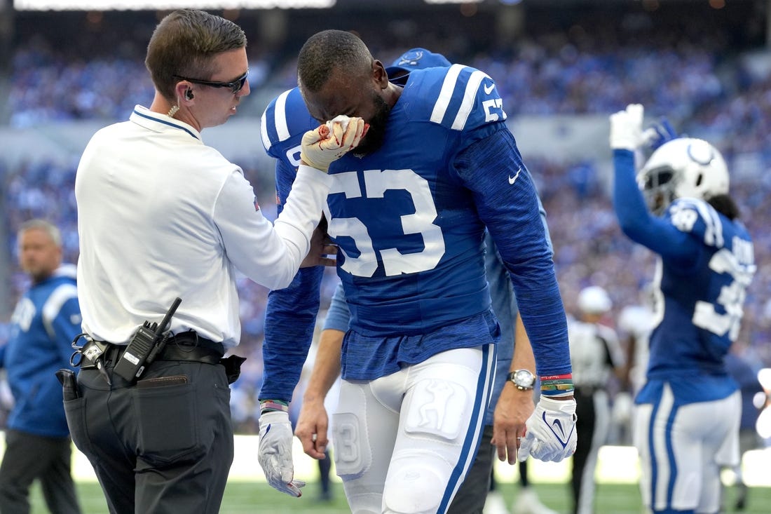 Training staff tends to Indianapolis Colts linebacker Shaquille Leonard (53) on Sunday, Oct. 2, 2022, during a game against the Tennessee Titans at Lucas Oil Stadium in Indianapolis.