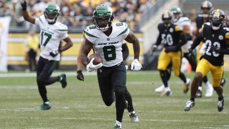 Oct 2, 2022; Pittsburgh, Pennsylvania, USA;  New York Jets wide receiver Elijah Moore (8) runs after a catch against the Pittsburgh Steelers during the first quarter at Acrisure Stadium. Mandatory Credit: Charles LeClaire-USA TODAY Sports