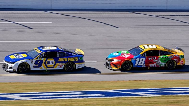 Oct 2, 2022; Talladega, Alabama, USA; NASCAR Cup Series driver Chase Elliott (9) and NASCAR Cup Series driver Kyle Busch (18) during the Yellawood 500 at Talladega Superspeedway. Mandatory Credit: Jasen Vinlove-USA TODAY Sports