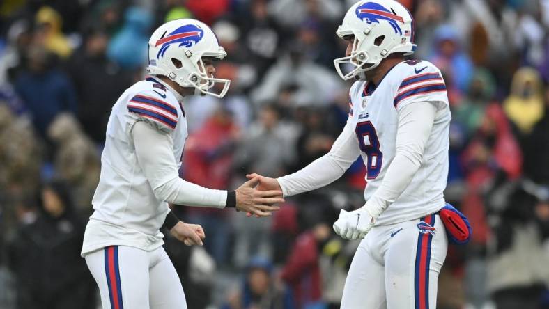 Oct 2, 2022; Baltimore, Maryland, USA;  Buffalo Bills place kicker Tyler Bass (2) celebrates with  punter Sam Martin (8) after kicking the game winning field goal with time expiring against the Baltimore Ravens at M&T Bank Stadium. Mandatory Credit: Tommy Gilligan-USA TODAY Sports