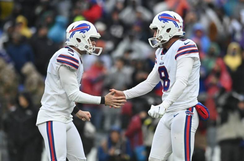 Oct 2, 2022; Baltimore, Maryland, USA;  Buffalo Bills place kicker Tyler Bass (2) celebrates with  punter Sam Martin (8) after kicking the game winning field goal with time expiring against the Baltimore Ravens at M&T Bank Stadium. Mandatory Credit: Tommy Gilligan-USA TODAY Sports