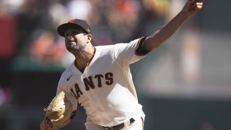 Oct 2, 2022; San Francisco, California, USA; San Francisco Giants starting pitcher Scott Alexander (54) delivers a pitch against the Arizona Diamondbacks during the first inning at Oracle Park. Mandatory Credit: D. Ross Cameron-USA TODAY Sports