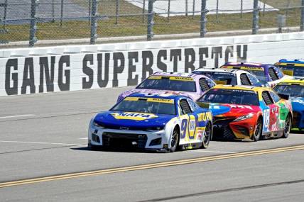 Oct 2, 2022; Talladega, Alabama, USA; NASCAR Cup Series driver Chase Elliott (9) leads the field during the Yellawood 500 at Talladega Superspeedway. Mandatory Credit: Marvin Gentry-USA TODAY Sports