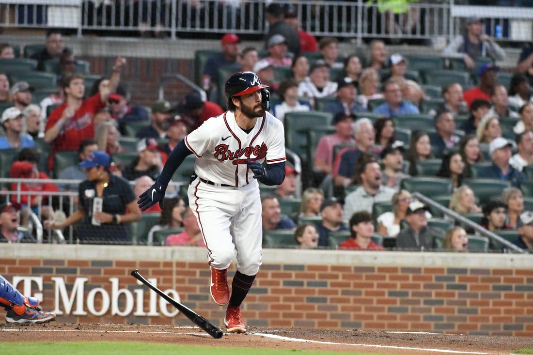 Oct 2, 2022; Cumberland, Georgia, USA; Atlanta Braves starting shortstop Dansby Swanson (7) hits a home run against the New York Mets in the first inning at Truist Park. Mandatory Credit: Larry Robinson-USA TODAY Sports