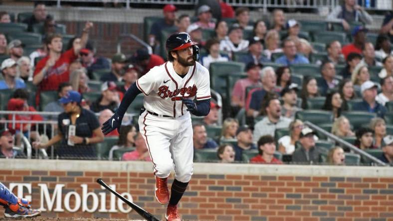 Oct 2, 2022; Cumberland, Georgia, USA; Atlanta Braves starting shortstop Dansby Swanson (7) hits a home run against the New York Mets in the first inning at Truist Park. Mandatory Credit: Larry Robinson-USA TODAY Sports