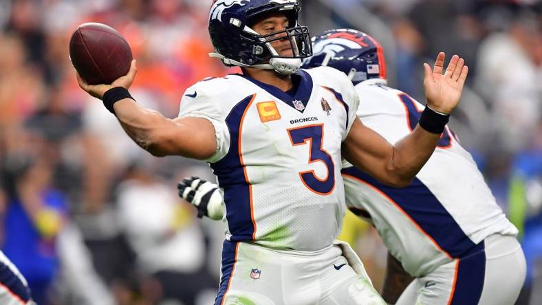 Oct 2, 2022; Paradise, Nevada, USA; Denver Broncos quarterback Russell Wilson (3) throws against the Las Vegas Raiders during the second half at Allegiant Stadium. Mandatory Credit: Gary A. Vasquez-USA TODAY Sports