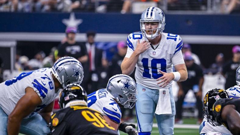 Oct 2, 2022; Arlington, Texas, USA; Dallas Cowboys quarterback Cooper Rush (10) sets the play at the line against the Washington Commanders during the game at AT&T Stadium. Mandatory Credit: Jerome Miron-USA TODAY Sports