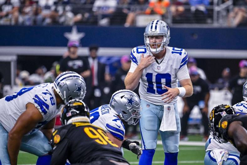 Oct 2, 2022; Arlington, Texas, USA; Dallas Cowboys quarterback Cooper Rush (10) sets the play at the line against the Washington Commanders during the game at AT&T Stadium. Mandatory Credit: Jerome Miron-USA TODAY Sports