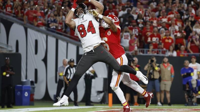 Oct 2, 2022; Tampa, Florida, USA;Kansas City Chiefs safety Bryan Cook (6) breaks up Tampa Bay Buccaneers tight end Cameron Brate (84) catch during the first half at Raymond James Stadium. Mandatory Credit: Kim Klement-USA TODAY Sports