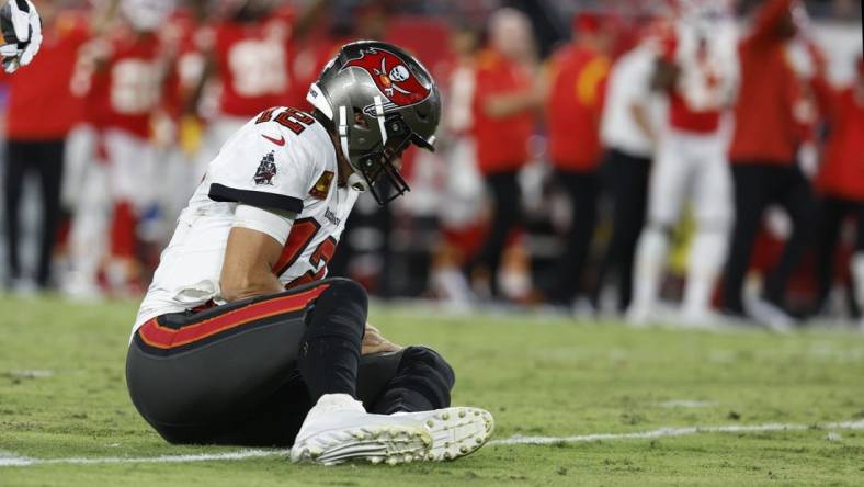 Oct 2, 2022; Tampa, Florida, USA; Tampa Bay Buccaneers quarterback Tom Brady (12) reacts after he was sacked and fumbled the ball against the Kansas City Chiefs during the first half at Raymond James Stadium. Mandatory Credit: Kim Klement-USA TODAY Sports