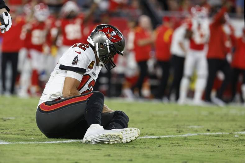 Oct 2, 2022; Tampa, Florida, USA; Tampa Bay Buccaneers quarterback Tom Brady (12) reacts after he was sacked and fumbled the ball against the Kansas City Chiefs during the first half at Raymond James Stadium. Mandatory Credit: Kim Klement-USA TODAY Sports