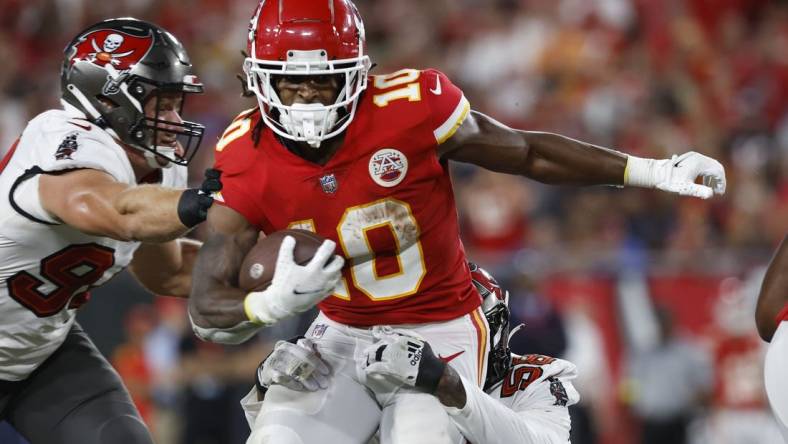 Oct 2, 2022; Tampa, Florida, USA; Kansas City Chiefs running back Isiah Pacheco (10) runs with the ball as Tampa Bay Buccaneers linebacker Shaquil Barrett (58) defends during the first half at Raymond James Stadium. Mandatory Credit: Kim Klement-USA TODAY Sports